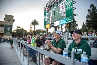 Cal Poly football fans enjoy watching a game last fall from the Cal Poly Partners Plaza on the north end of the stadium.