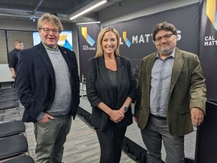 Cal Poly computer science professor Alex Dekhtyar, CBS reporter Julie Watts and Cal Poly computer science professor Foaad Khosmood at a CalMatters gathering