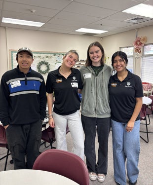 College Corps Fellows tutoring with the Center for Engineering, Science and Mathematics Education students in an area school