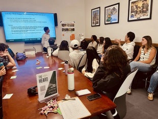 EARD members in a conference room give feedback to architects designing the proposed Lynda and Stewart Resnick Student Success Center