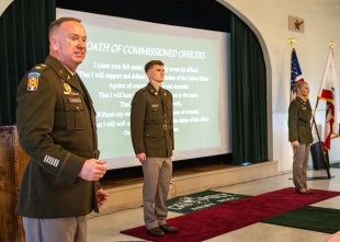 Lt. Col. Mark Swiney with two Army ROTC cadets at 2026 commissioning ceremony
