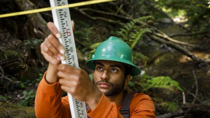 Student making measurements in a Swanton Ranch forest. 