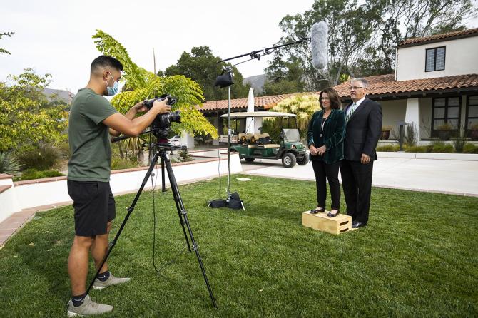 Matt Yoon sets up a video shot of President and Mrs. Armstrong