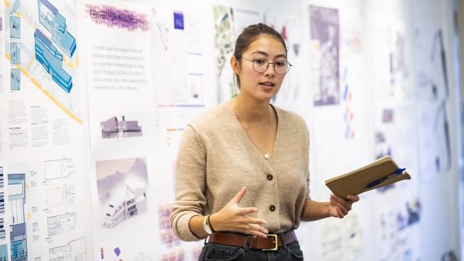 Cal Poly student gives a presentation to her Architecture class