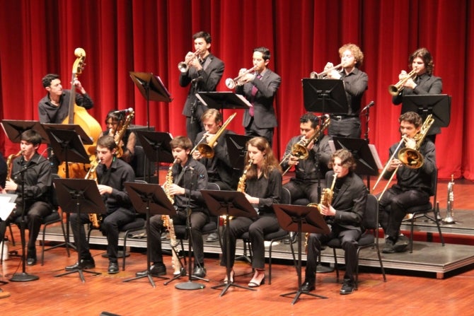 The University Jazz Band that features 13 student musicians perform on stage