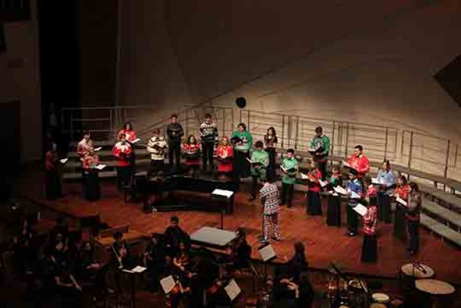 Members of the choir take stage at a past show