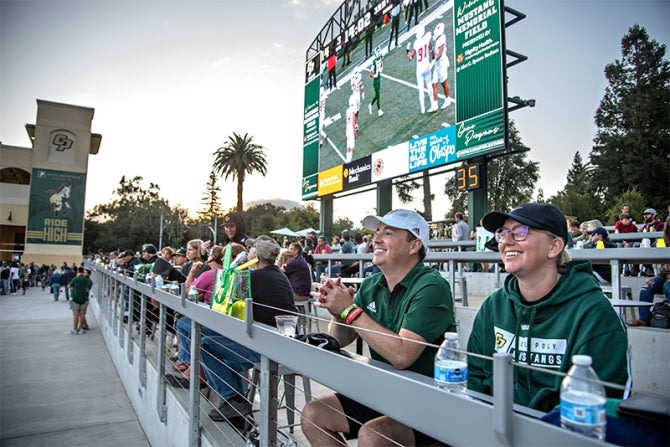 Cal Poly football fans enjoy watching a game last fall from the Cal Poly Partners Plaza on the north end of the stadium.