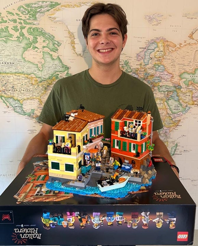 Computer science student Alex Sahli holds the Lego Italian Riviera set he designed