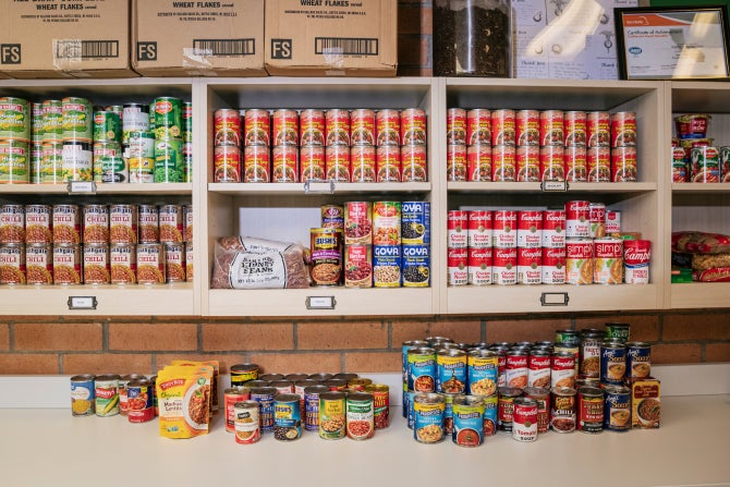 Canned food lines the shelving at the Cal Poly Food Pantry