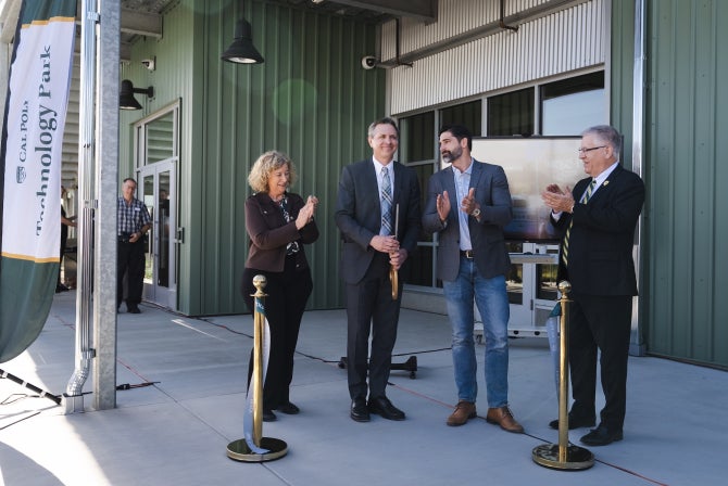 Cal Poly President Jeffrey Armstrong and other officials participate in the ribbon cutting opening the new Tech Park structure
