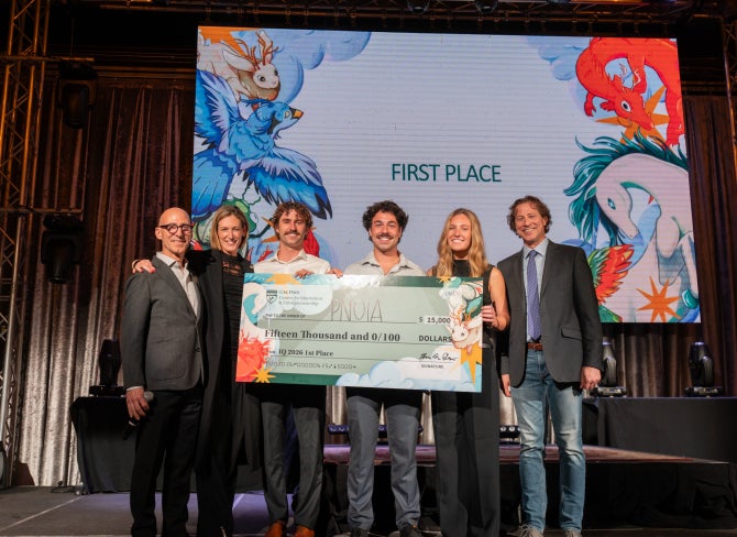 Developers of PNOIA receive the $15,000 top prize on stage