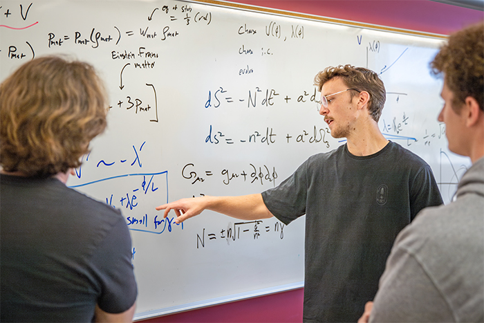 Physics major Josiah Hauck is working with Assistant Professor Ben Shlaer on a cosmology study