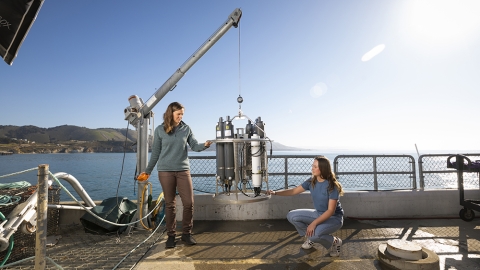 Student and faculty work with equipment at the Cal Poly Pier in Avila Beach
