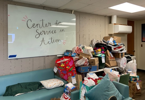 Donated items piled in the Center for Service in Action