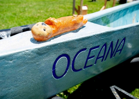 the bow of Oceana features the name and a colorful concrete otter nicknamed Ellie on the bow deck