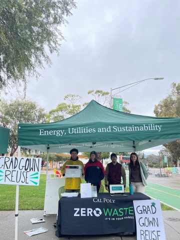 Student members of the Cal Poly Zero Waste Club hold a boothing event on campus. The group held the event to take in slightly used graduation gowns that can be used again at commencement. 