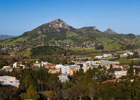 A view of Cal Poly looking west from an eastside hill over the buildings of the campus core to Bishop Peak and beyond