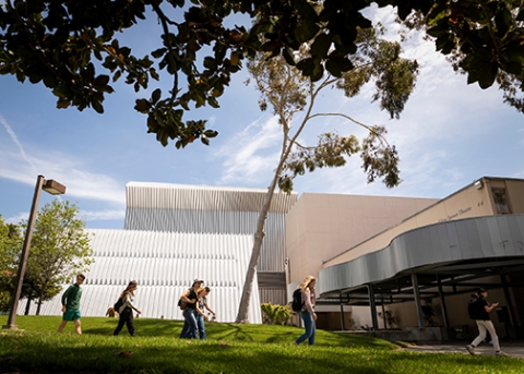 Students walk toward Spanos Theater in the heart of the Cal Poly campus