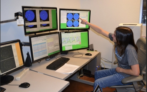 A Cal Poly physics student sits at the computer controls for the VERITAS telescopes