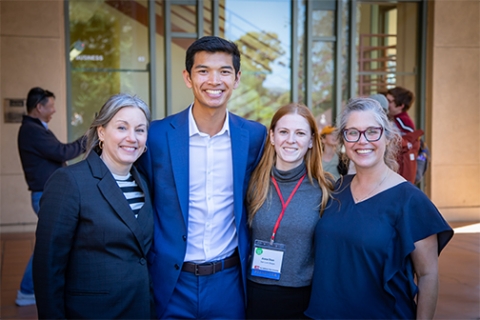 Cal Poly students Harrison Oen and Anna Dion stand with university representatives at the CSU Research Competition held at Cal Poly