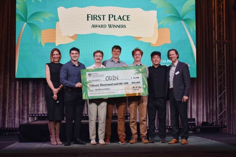 First Place Award went to the startup ODIN pictured on stage