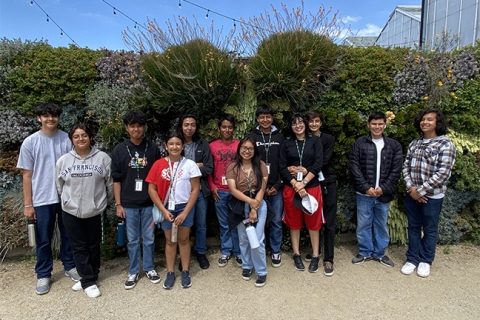 High school students in Cal Poly’s Upward Bound program pose on campus in front of the Plant Conservatory