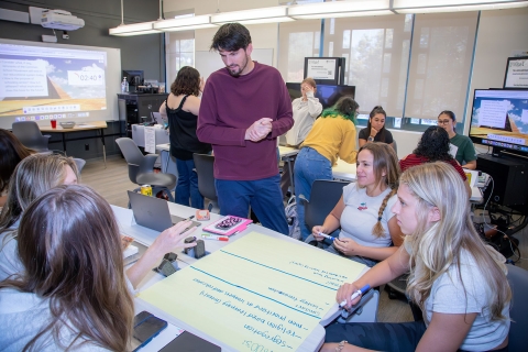 A Cal Poly faculty member in the School of Education during a class discussion