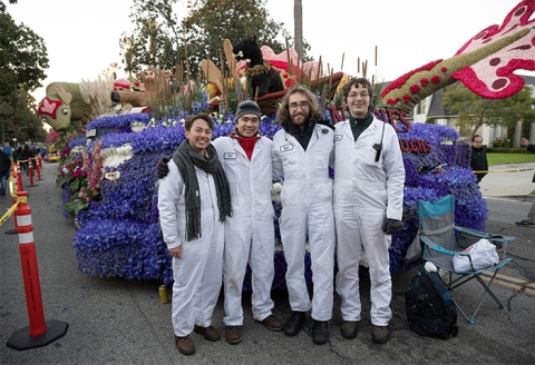 The four onboard float operators stand outside Cal Poly Universities 2025 Rose Float entry Nessies Lakeside Laughs