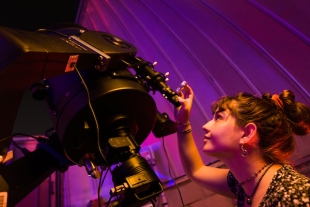 Student using large telescope