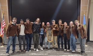 Cal Poly soil team members gather onstage for a group photo