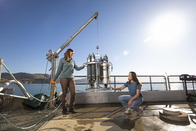 Cal Poly student and faculty research sea water at the Cal Poly pier