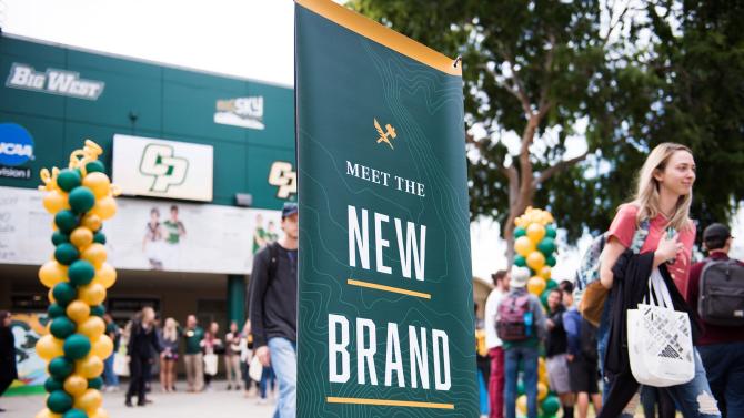 sign stating "meet the new brand" at event on Mott Lawn
