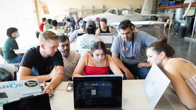 Students work together in an aero lab learning about aircraft performance