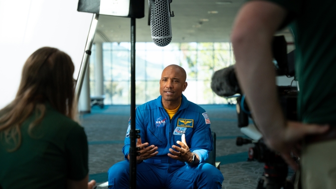 Image of astronaut Victor Glover being interviewed.